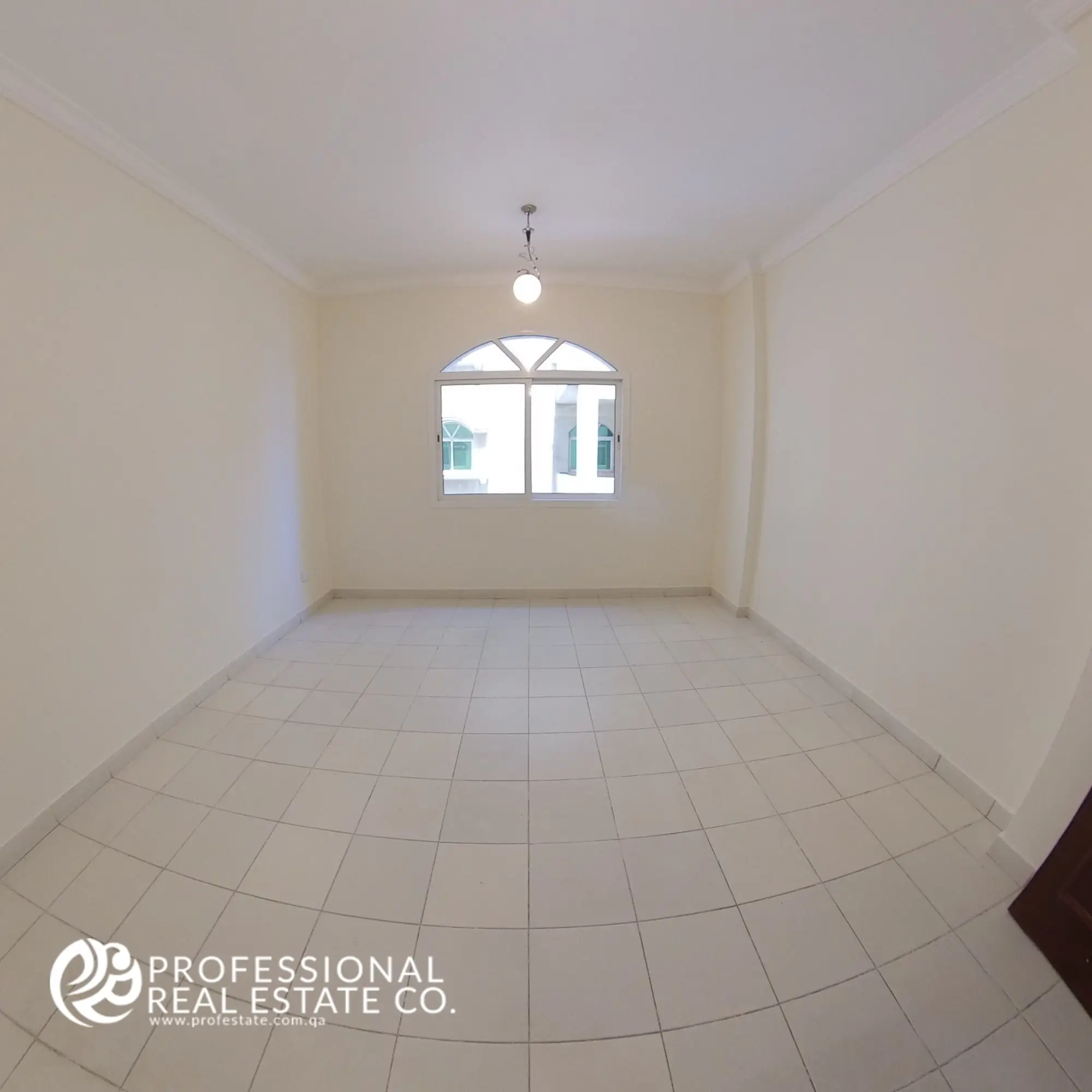 Bedroom 1 with tiled flooring and neutral walls in an unfurnished 3 BHK apartment in Bin Mahmoud, Doha