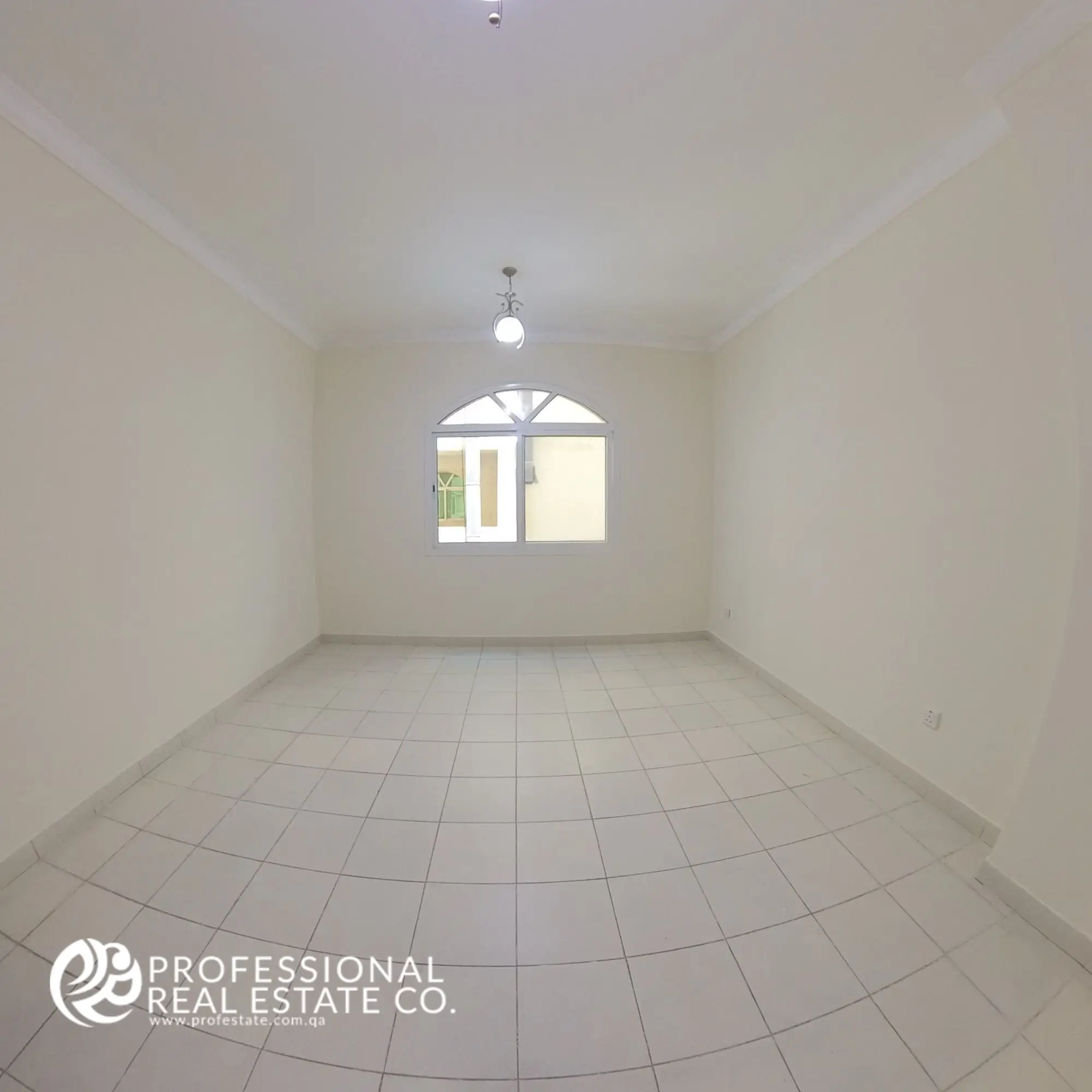 Bedroom 2 with tiled flooring and neutral walls in an unfurnished 3 BHK apartment in Bin Mahmoud, Doha