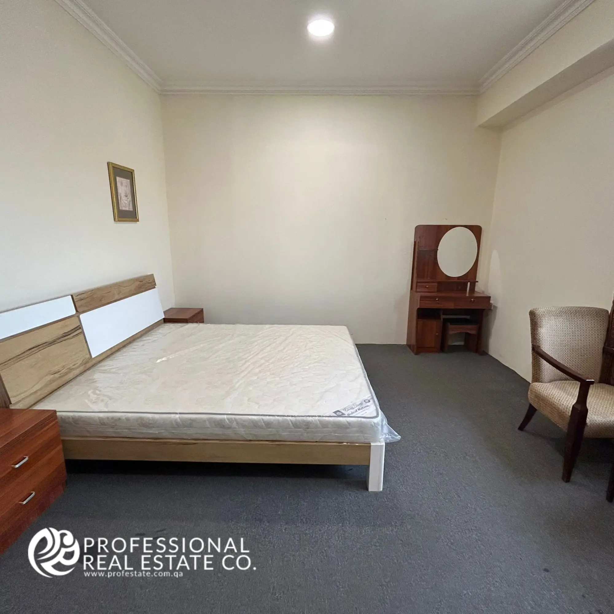 Cozy bedroom in a fully furnished 1 BHK apartment in Umm Ghwailina, featuring a stylish layout with comfortable furnishings and a peaceful atmosphere.