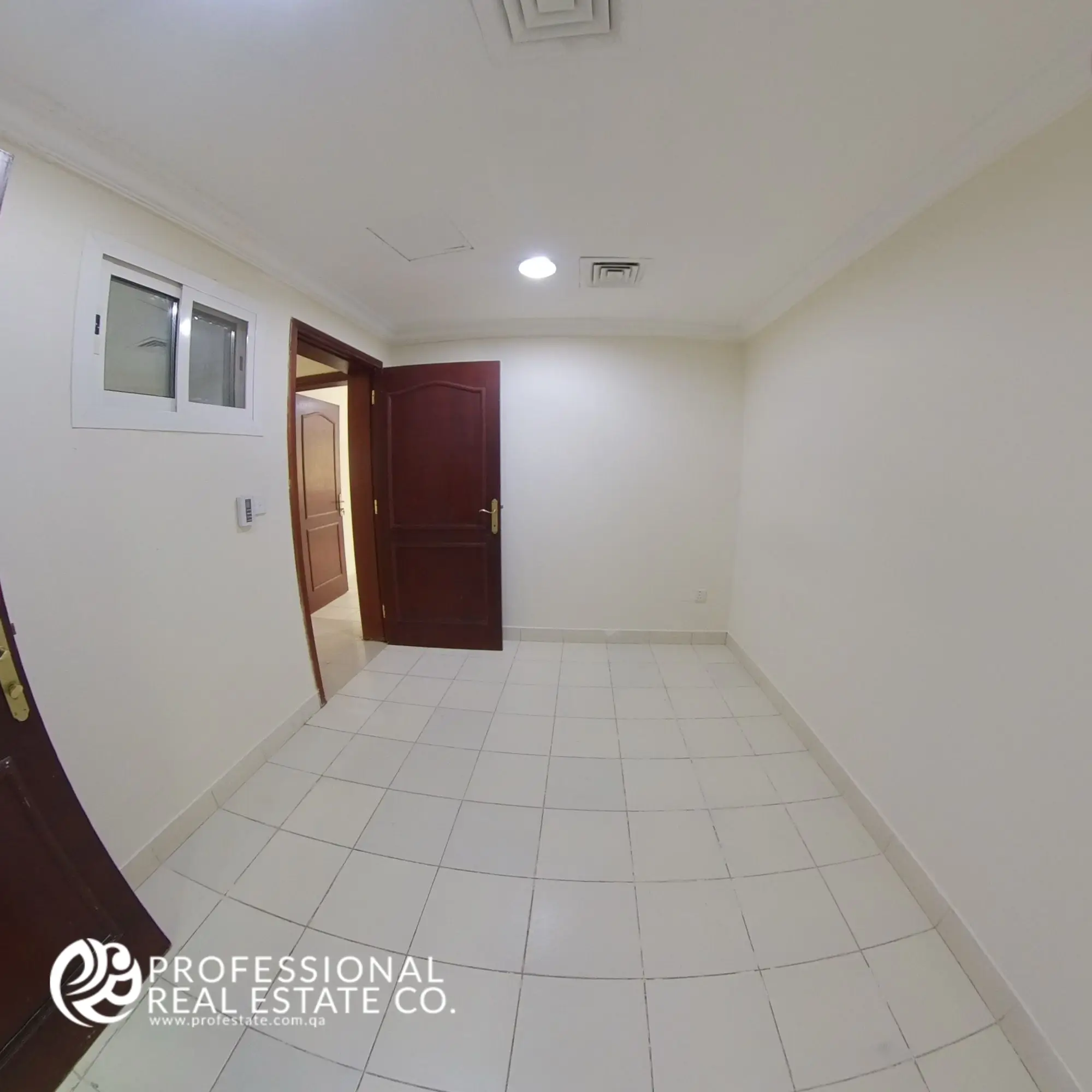Bedroom 3 with tiled flooring and neutral walls in an unfurnished 3 BHK apartment in Bin Mahmoud, Doha