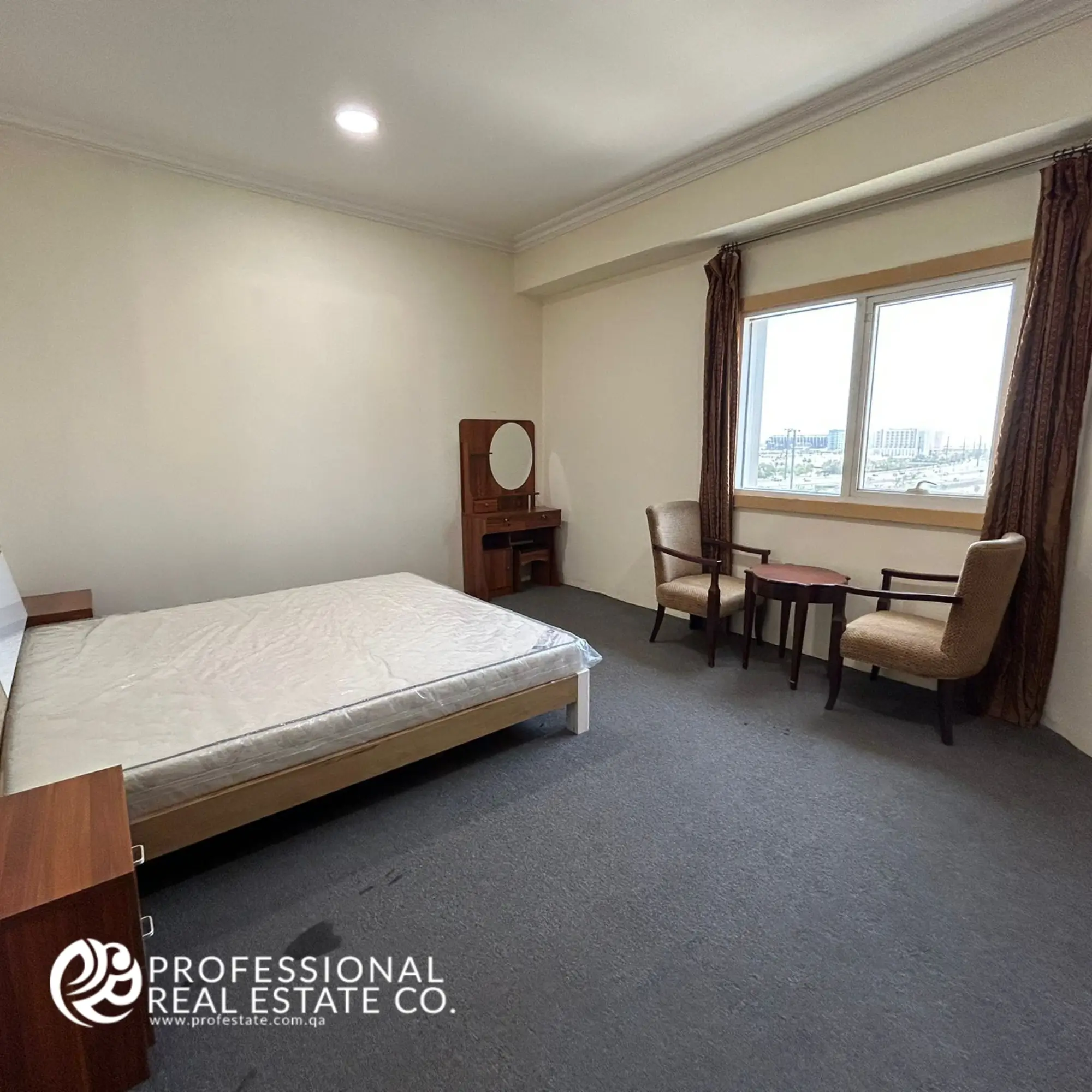Bedroom featuring the window side in a fully furnished 1 BHK apartment in Umm Ghwailina, showcasing natural light and a cozy atmosphere.