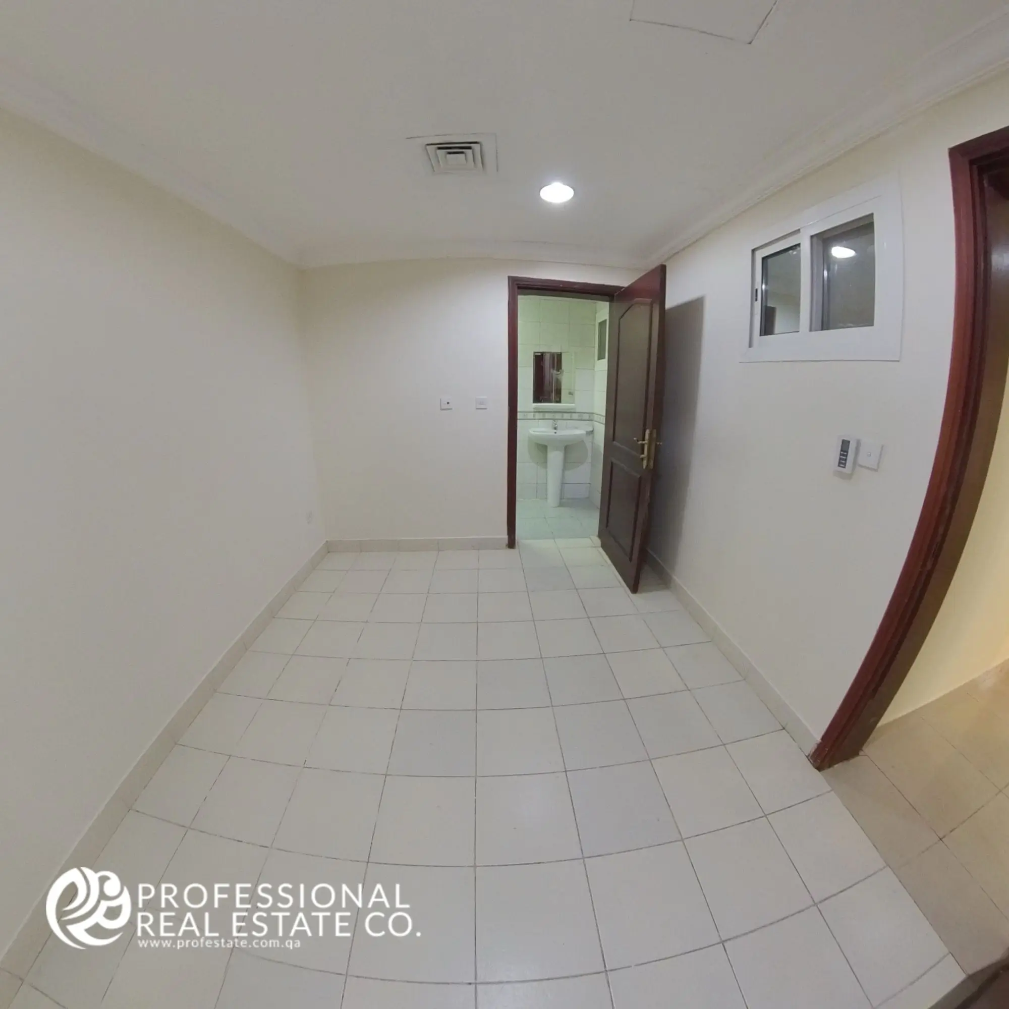 Bedroom 3 facing toilet door in an unfurnished 3 BHK apartment in Bin Mahmoud, Doha