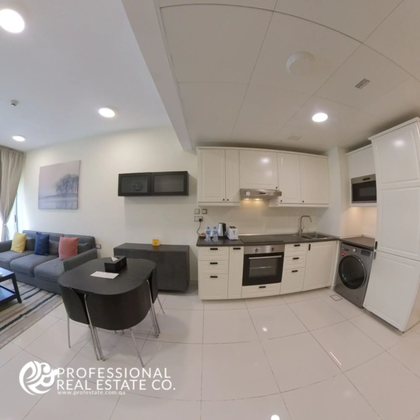 Open kitchen with modern fittings and stylish cabinetry in a fully furnished 1 bedroom apartment in Bin Omran, Doha
