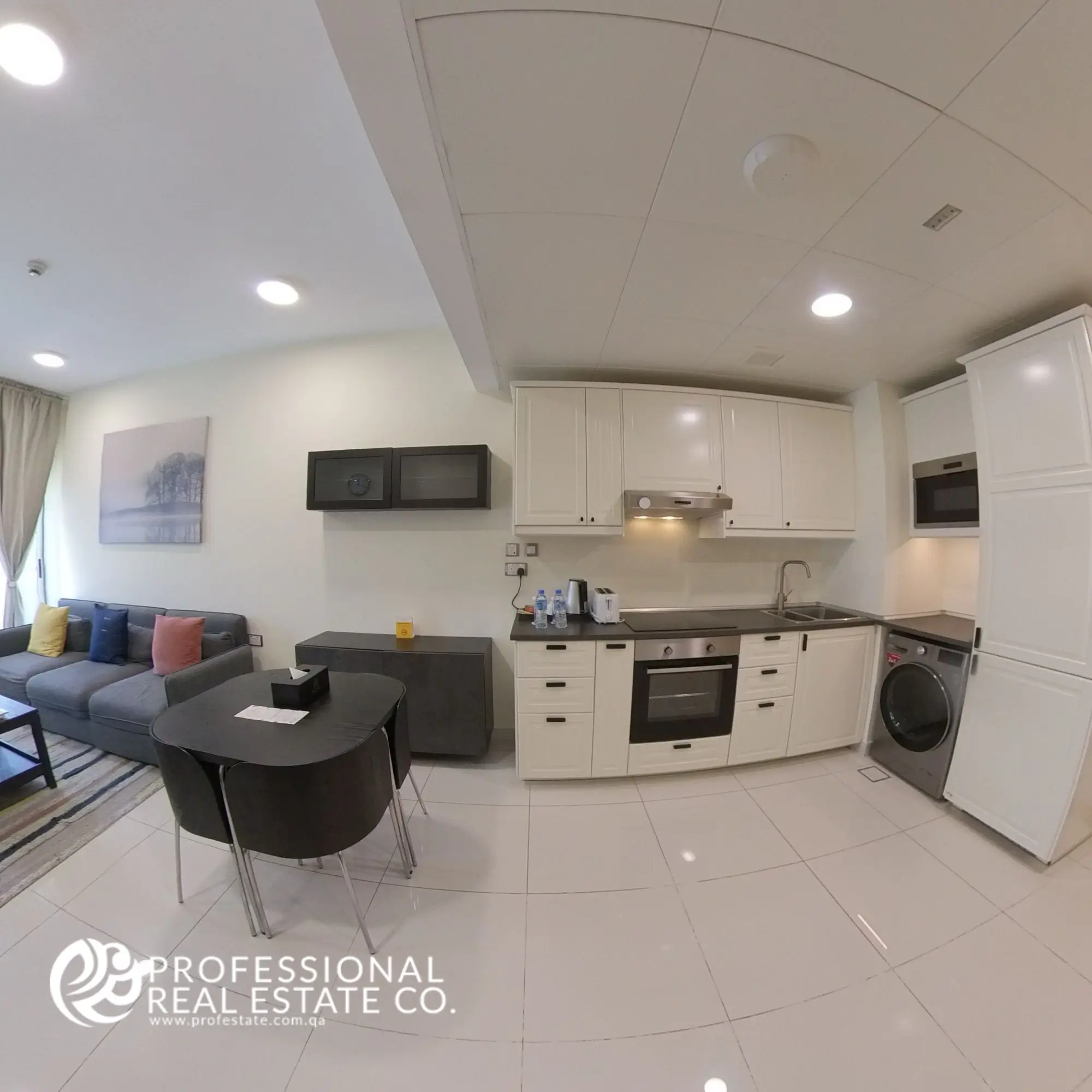 Open kitchen with modern fittings and stylish cabinetry in a fully furnished 1 bedroom apartment in Bin Omran, Doha