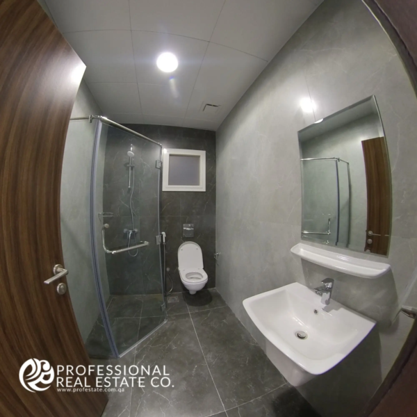 Second toilet with shower compartment in a fully furnished 2 BHK apartment in Al Waab, Doha