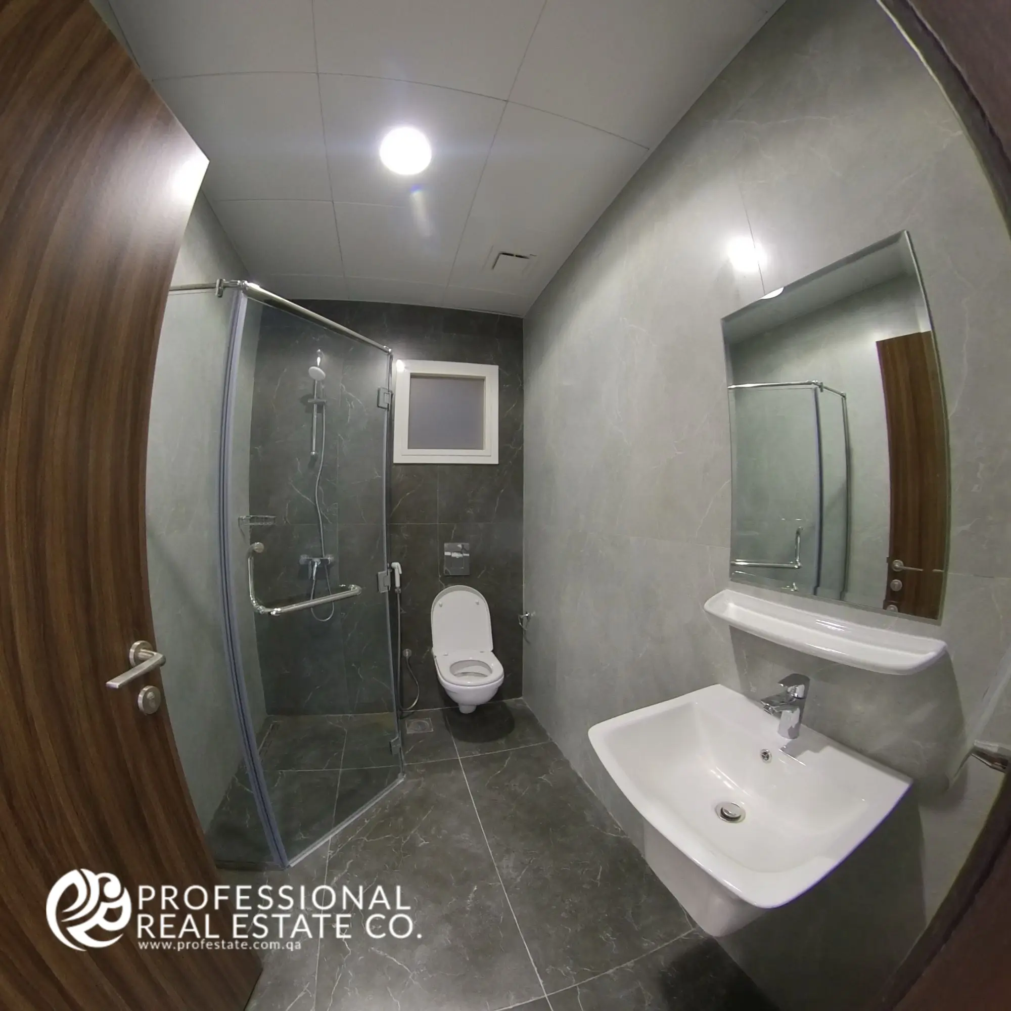 Second toilet with shower compartment in a fully furnished 2 BHK apartment in Al Waab, Doha