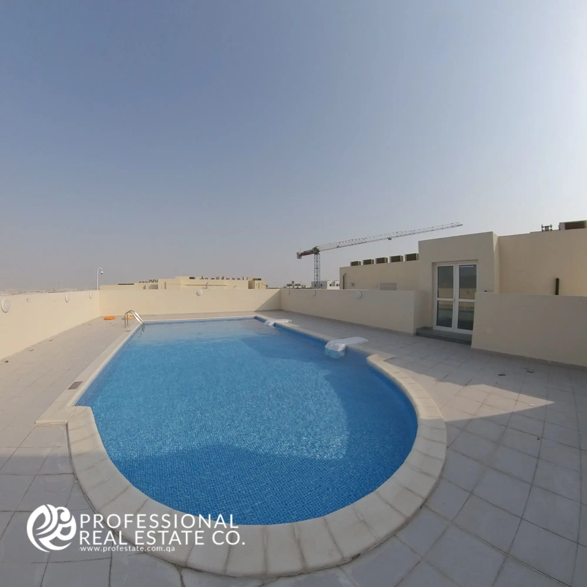 Swimming pool area in a fully furnished 2 BHK apartment in Al Waab, Doha