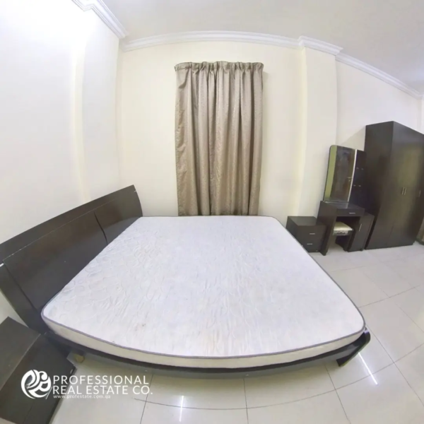 Closer view of the bed in fully furnished studio apartment in Bin Mahmoud, Doha
