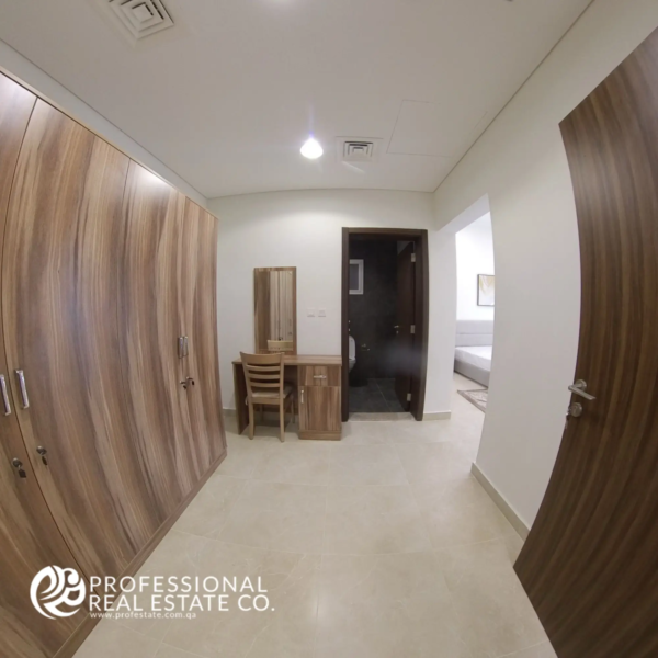 Wardrobe area with built-in closets in a fully furnished 2 BHK apartment in Al Waab, Doha