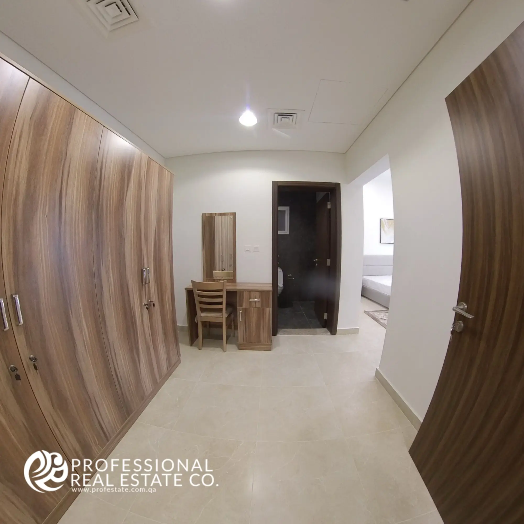 Wardrobe area with built-in closets in a fully furnished 2 BHK apartment in Al Waab, Doha