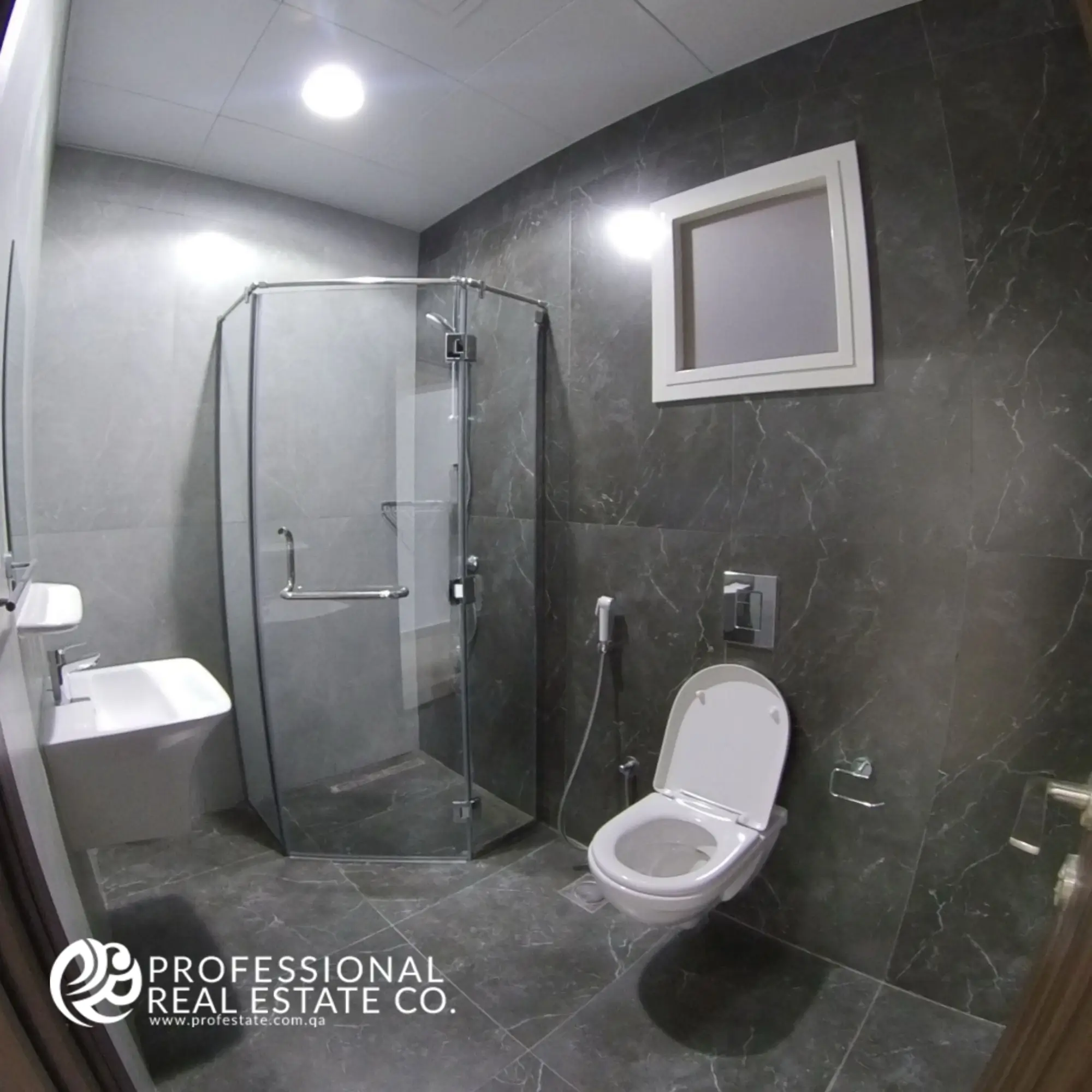 Toilet room with shower compartment in a fully furnished 2 BHK apartment in Al Waab, Doha